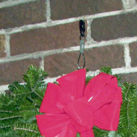 A rurp holding up the wreath