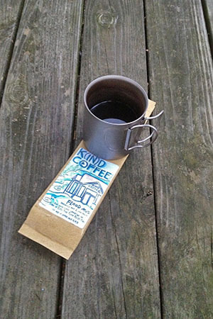 mug of brew with the Flood Mud bag.