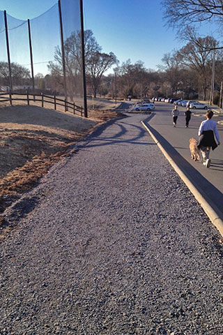 New path along the parking area of the Community Center. The path goes around the driving range