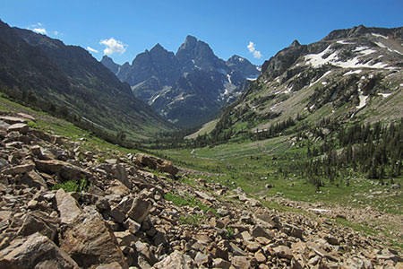 a valley frames the Teton mountains