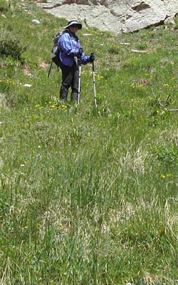 Laura descending grassy slope