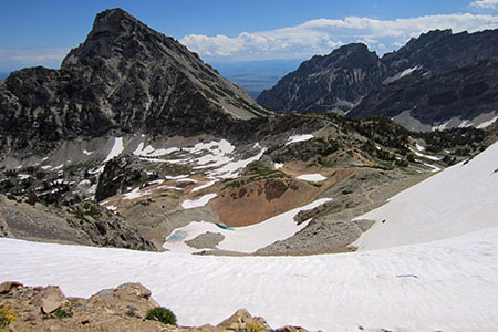 Snow covers the path below the divide