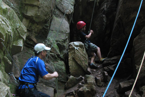 small boy climbing