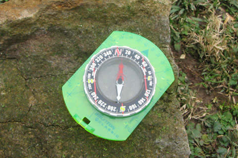 compass on a rock